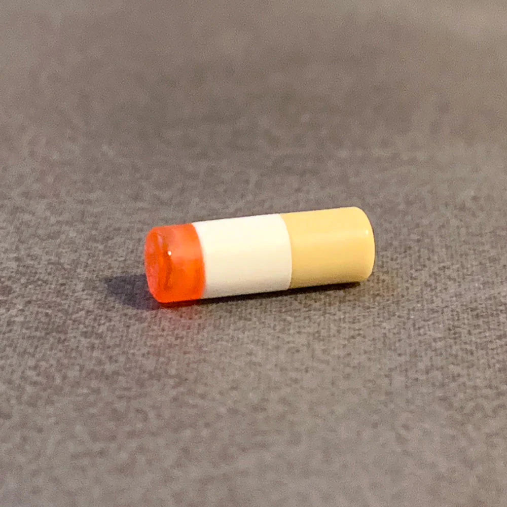 Overmolded cigarette